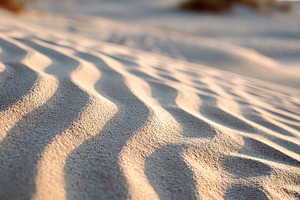 Close-up of textured sand dunes in warm hues, a Nature Photo by AlyaAnd