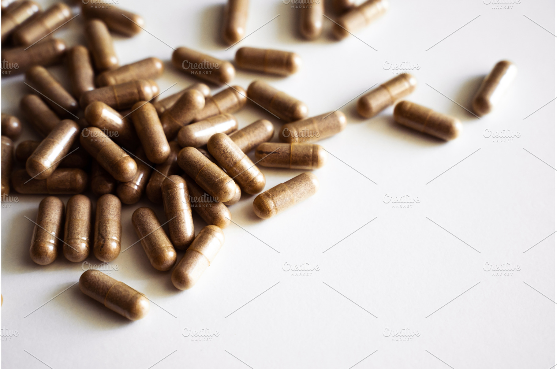 Brown herbal capsules close up, a Health & Medical Photo by volodymyrshtun13795