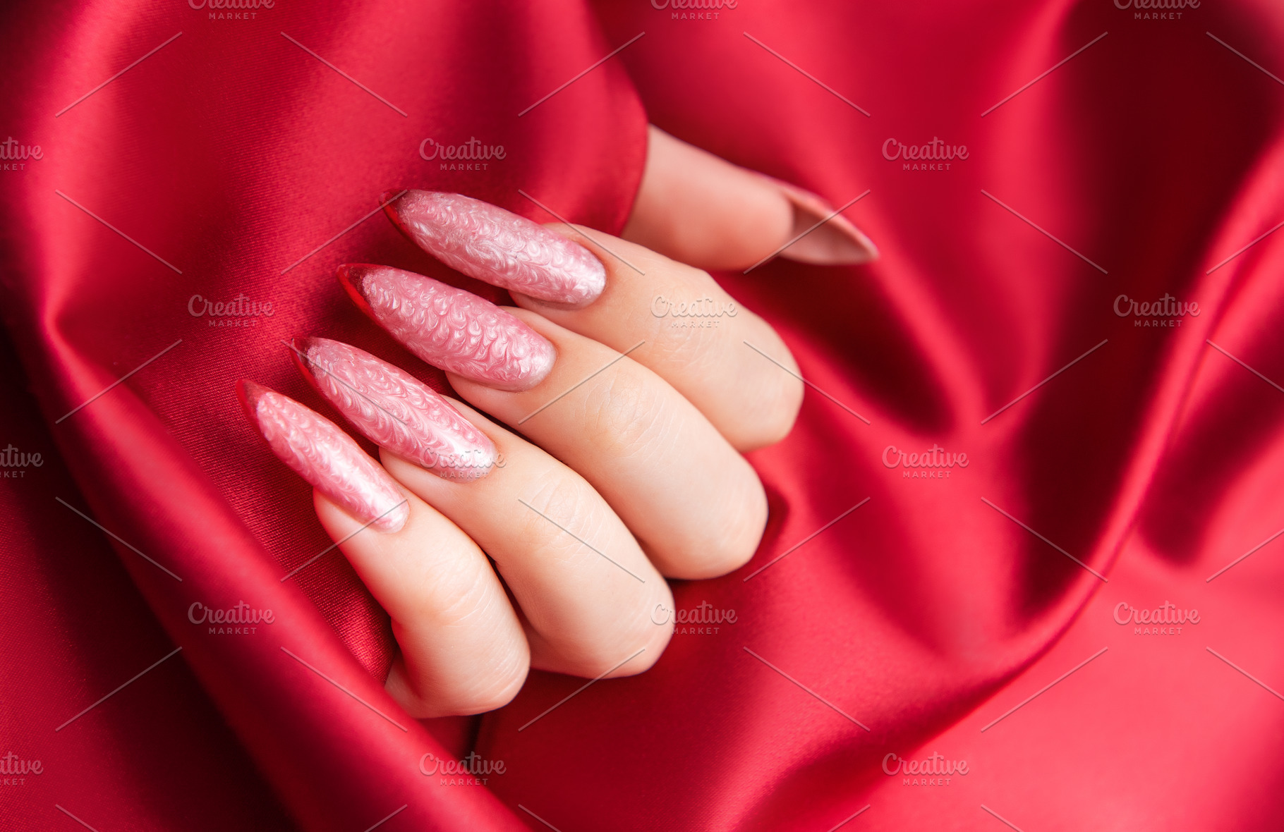 Female hand showing fashionable pink almond nails, a Beauty & Fashion Photo by Olena Rudo