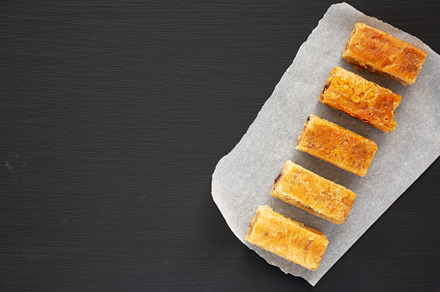 Homemade Baklavas with Honey, Chocolate and Almond on a black ba, a Food & Drink Photo by LiudmylaChuhunova