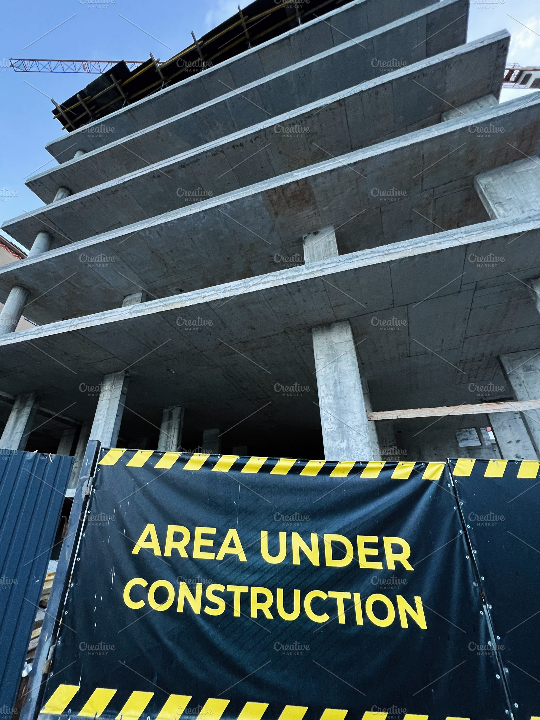 Construction site with concrete building structure under development and safety, a Photo by AS photostudio