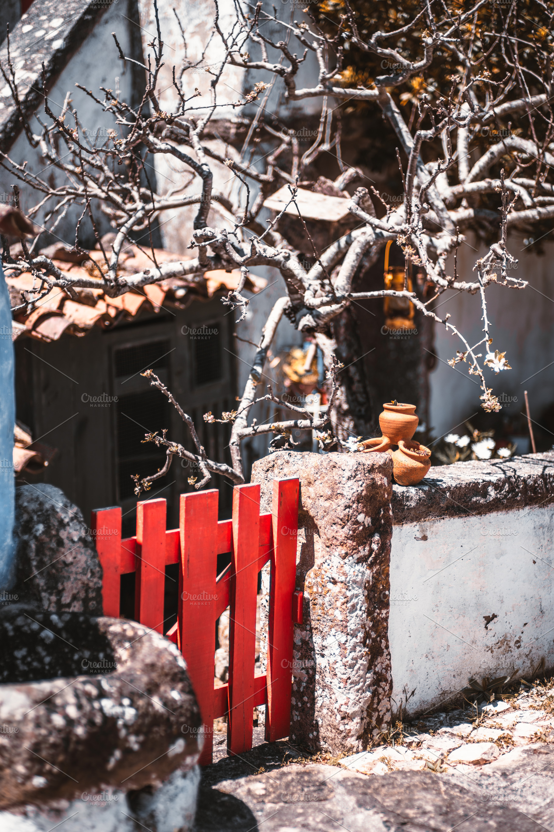 Red gate and rustic stone wall, an Architecture Photo by SkyNext