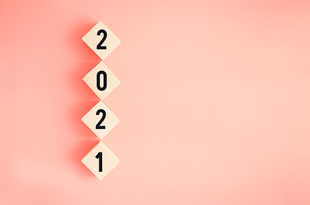 New year and goals for success concept, Text 2021 on wooden blocks on pink back