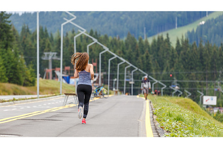 Young slim woman running on the road, a Sports & Recreation Photo by serkum