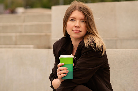Young woman holding coffee cup