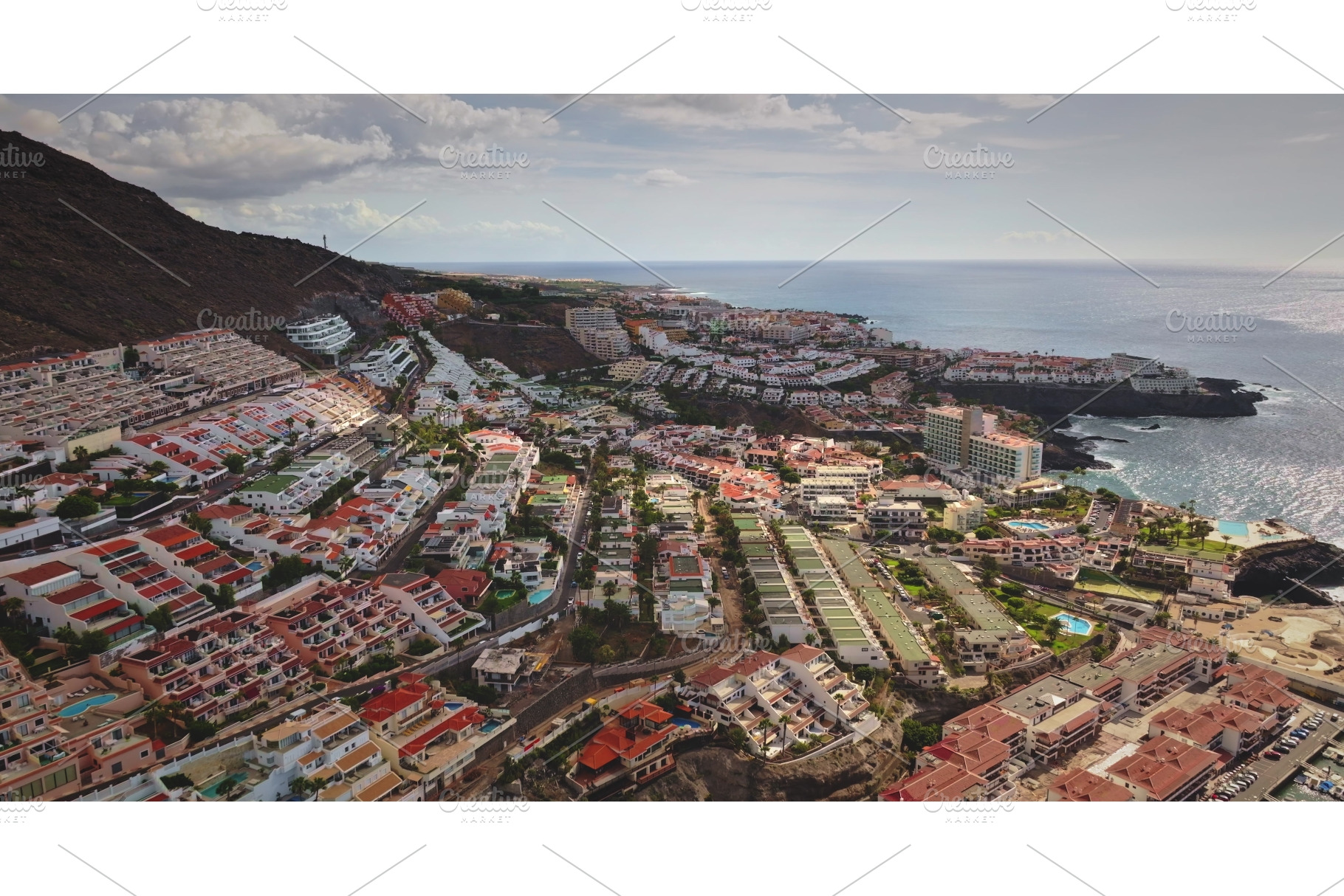 Los Gigantes coastal town built into, an Architecture Photo by Goinyk