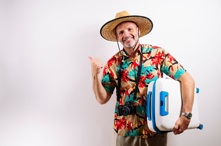 Smiling man ready for tropical vacation adventure