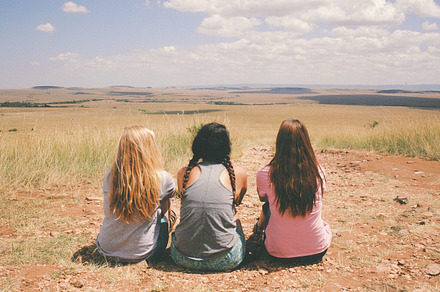 Three Girls Sitting in the Desert