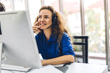 Beautiful happy call center smiling businesswoman operator custo, a Photo by Art_Photo