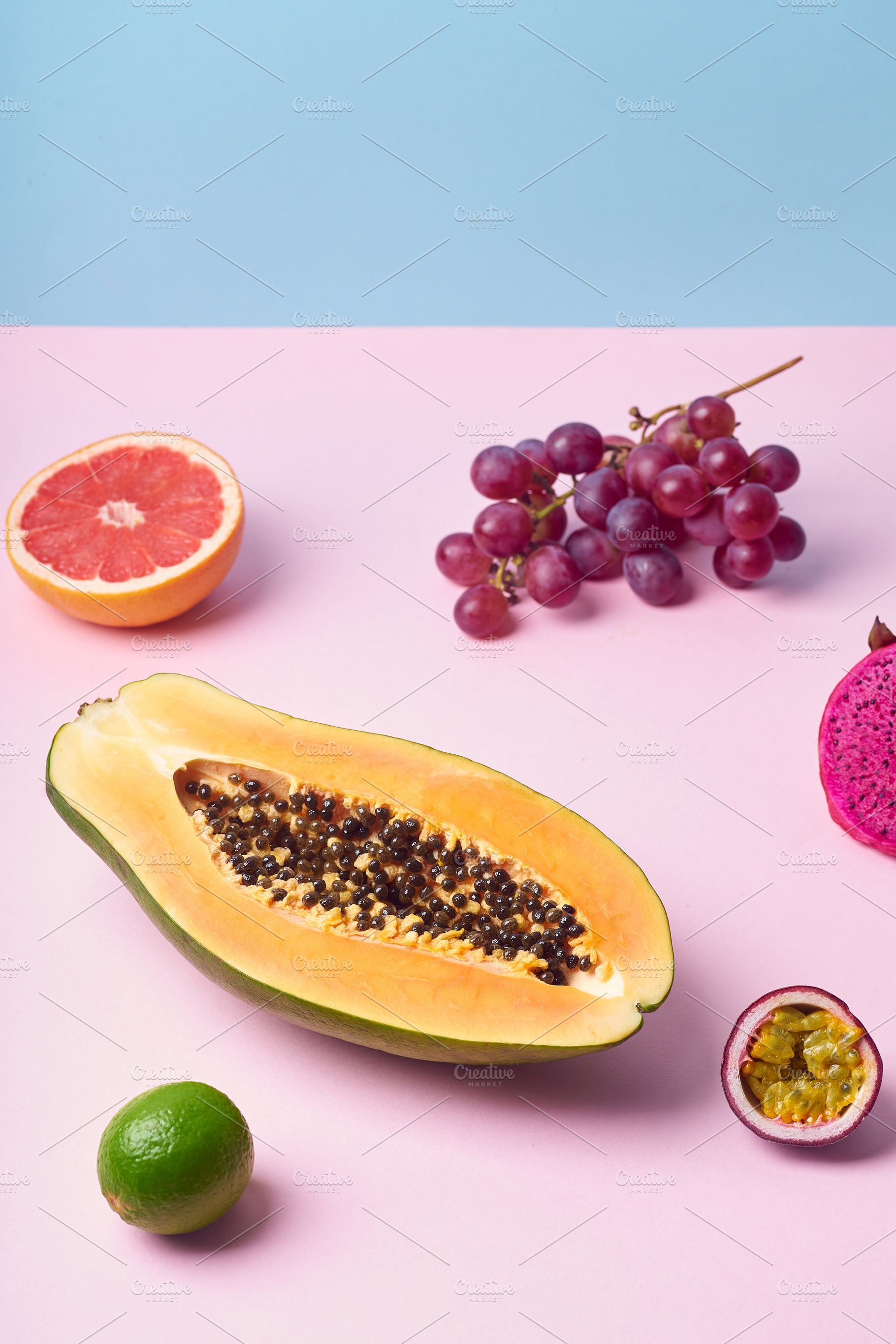 Tropical fruits variety on a colorful background. Side view with, a Food & Drink Photo by Asya Nurullina