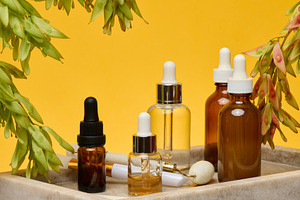 Stone rollers and gua sha with glass bottles with pipettes stot, a Food & Drink Photo by ndanko