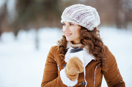 happy elegant woman outside in city park in winter, a Person Photo by Alliance Images