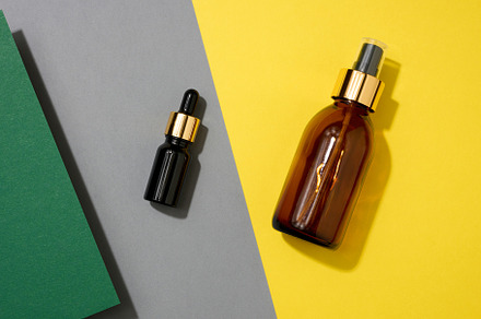 glass cosmetic brown bottles with a pipette on a yellow backgrou, a Beauty & Fashion Photo by ndanko