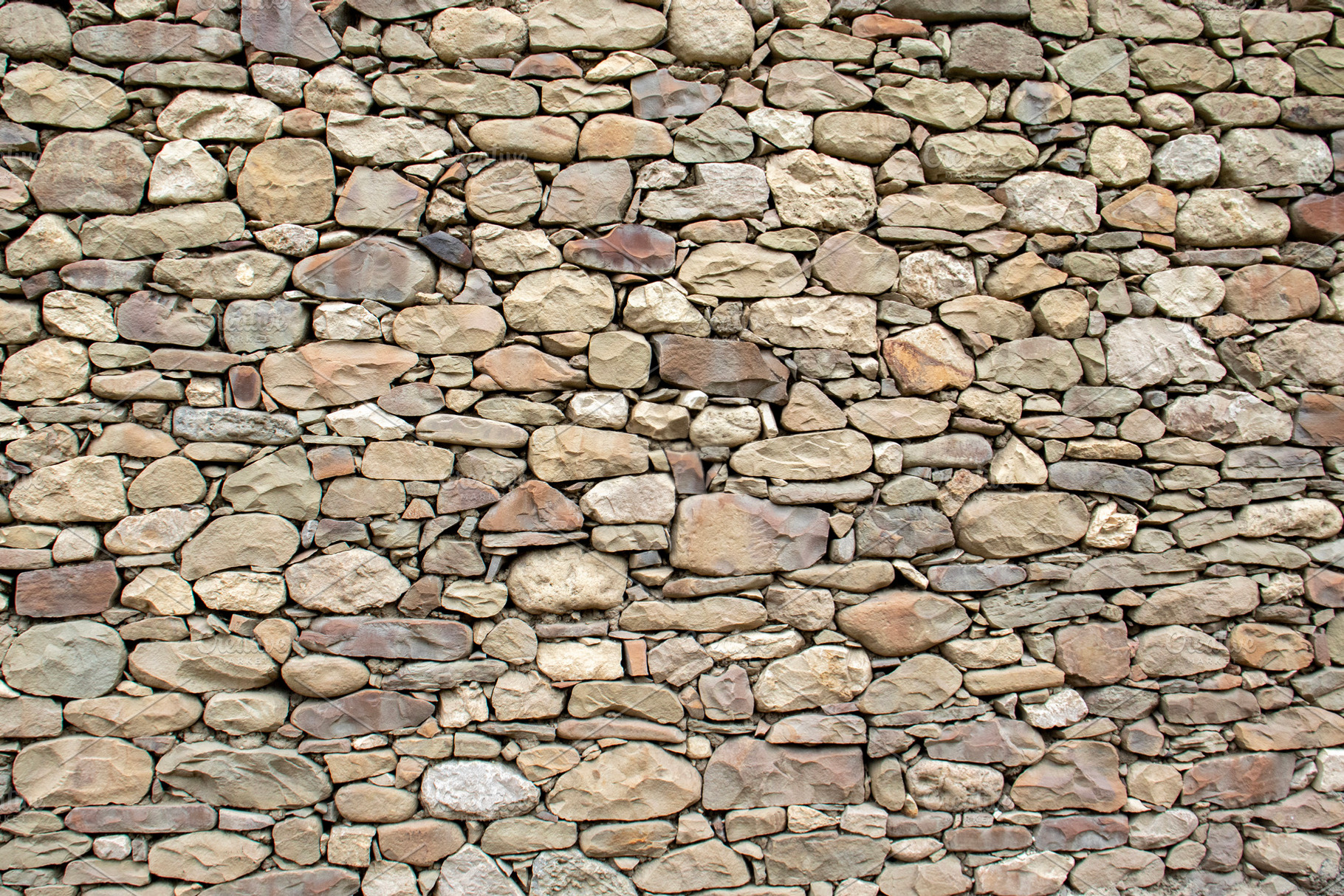 Stones laid in a wall, a Technology Photo by Schreibikus