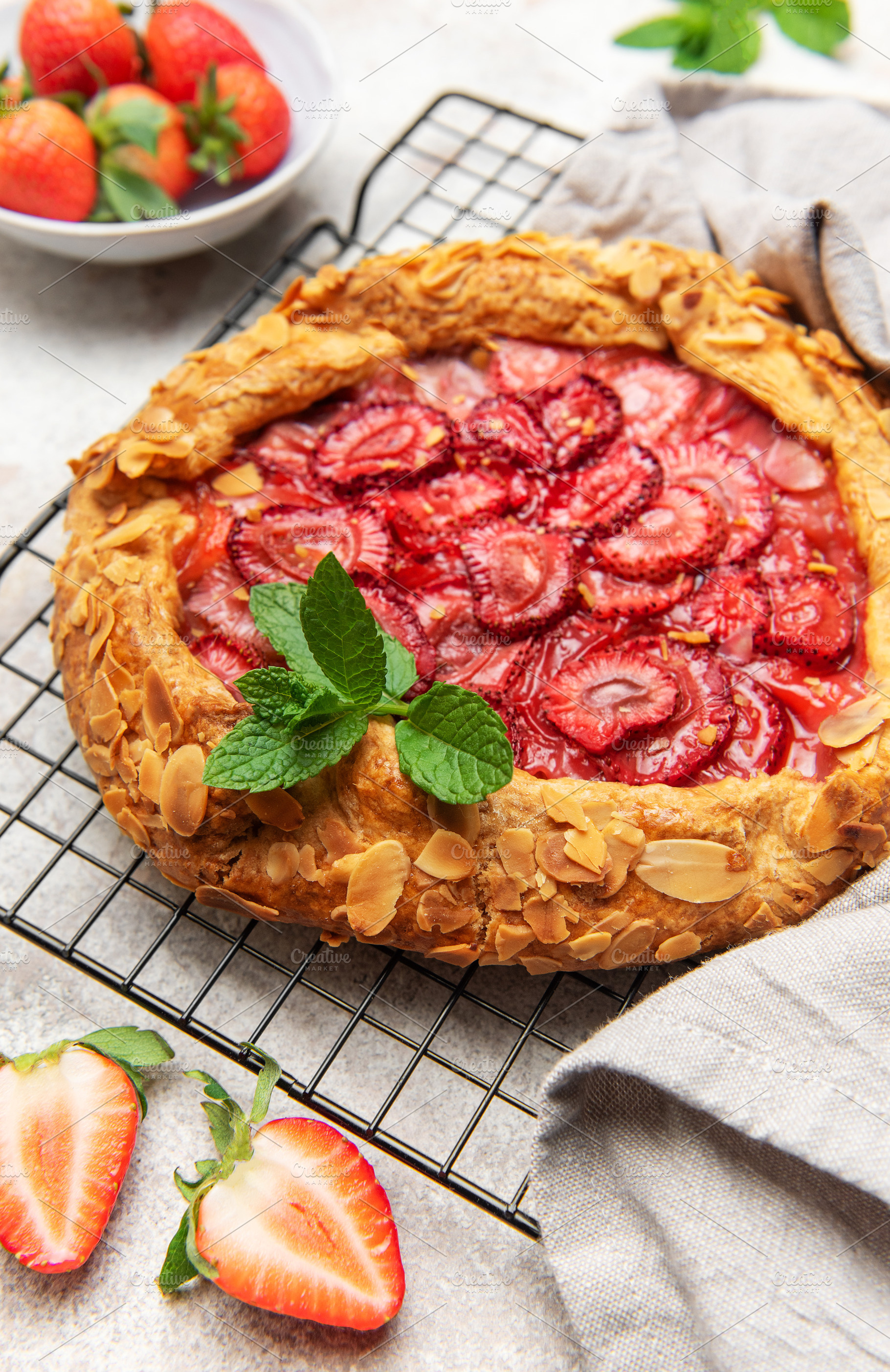 Delicious homemade strawberry galette cooling on wire rack, a Food & Drink Photo by Olena Rudo