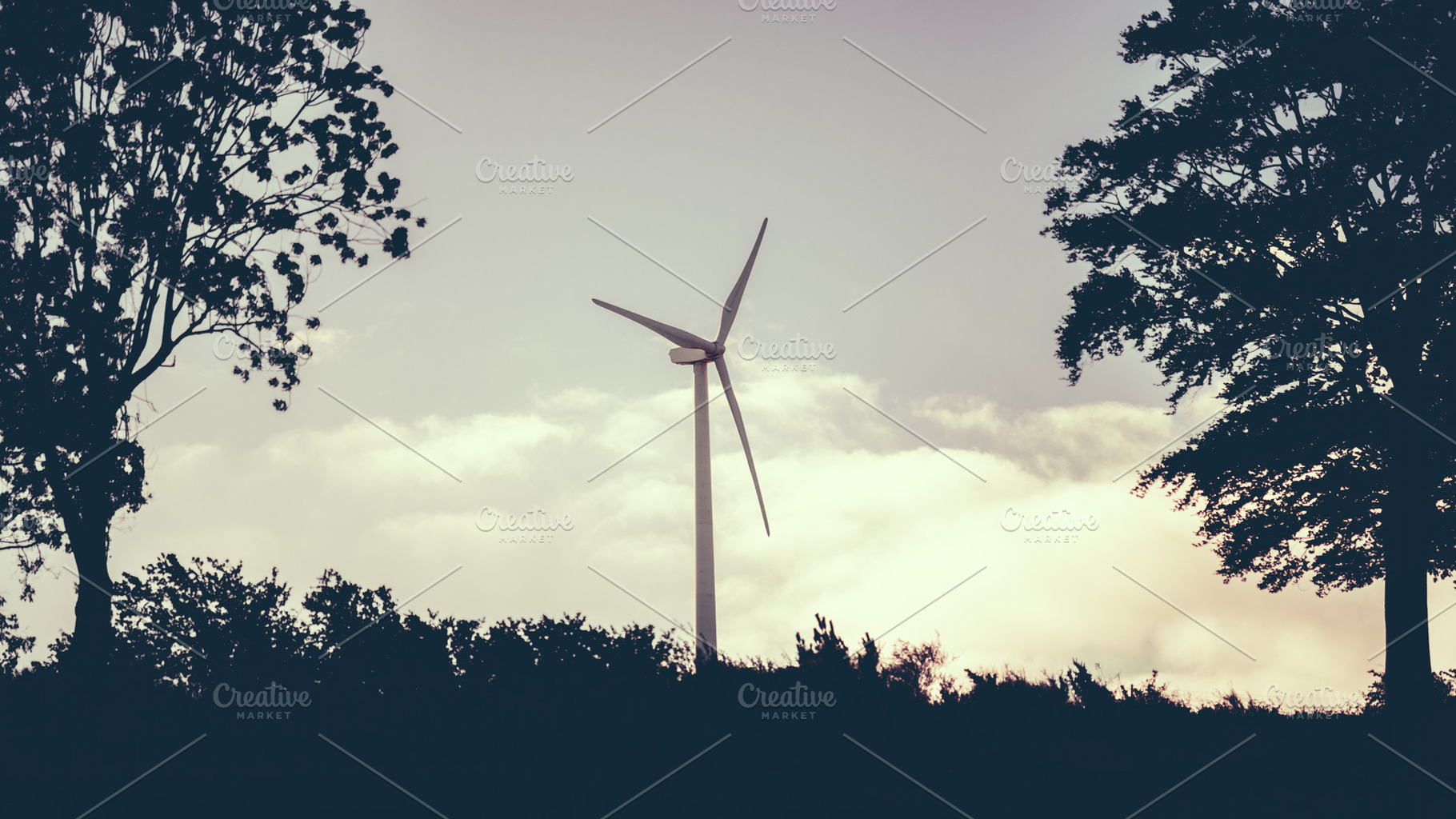 Wind turbine silhouette at dusk, an Industrial Photo by SkyNext