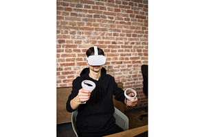 Person immersed in virtual reality, a Technology Photo by wip3out