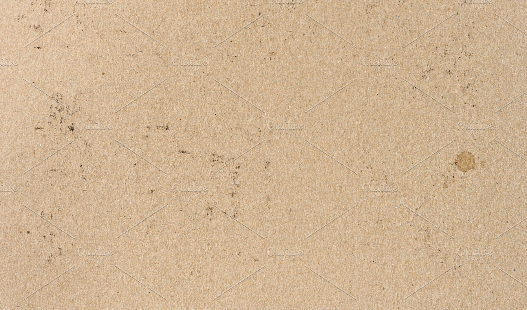Texture of old brown kraft paper with spots and inclusions, a Background Photo by ndanko