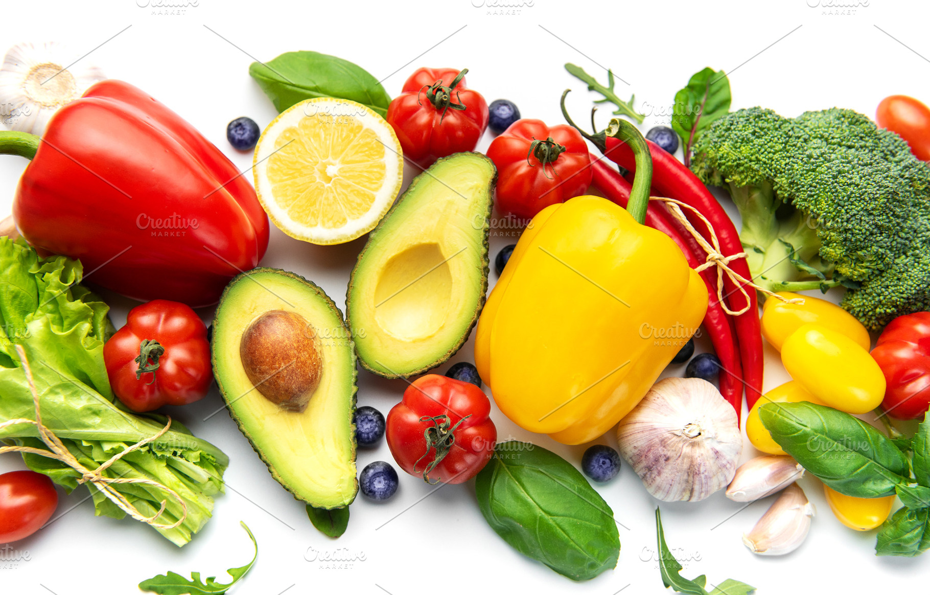 Fresh healthy eating ingredients arranged on white background, a Food & Drink Photo by Olena Rudo