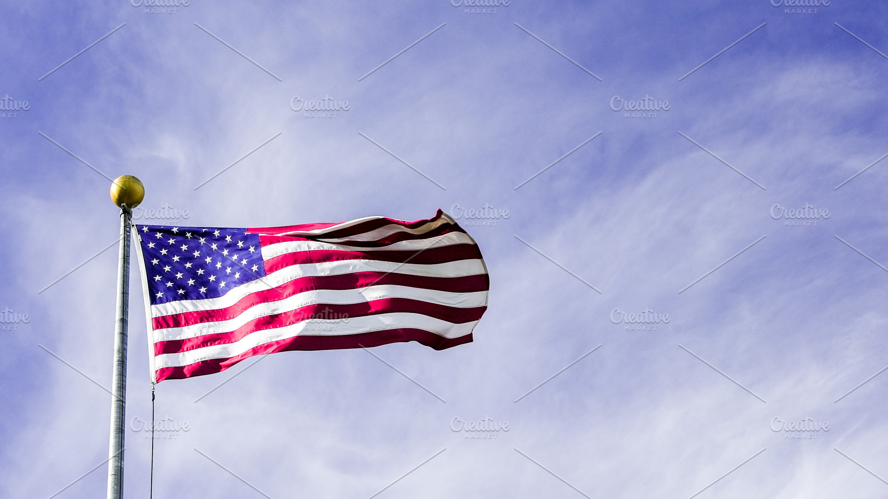 Waving American flag against a clear, a Holiday Photo by 1miromiro