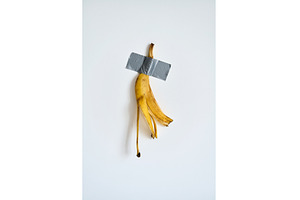 Banana peel taped to white wall, an Arts & Entertainment Photo by Gladkov photography