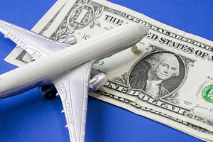 Model airplane resting on one dollar, a Transportation Photo by 1miromiro