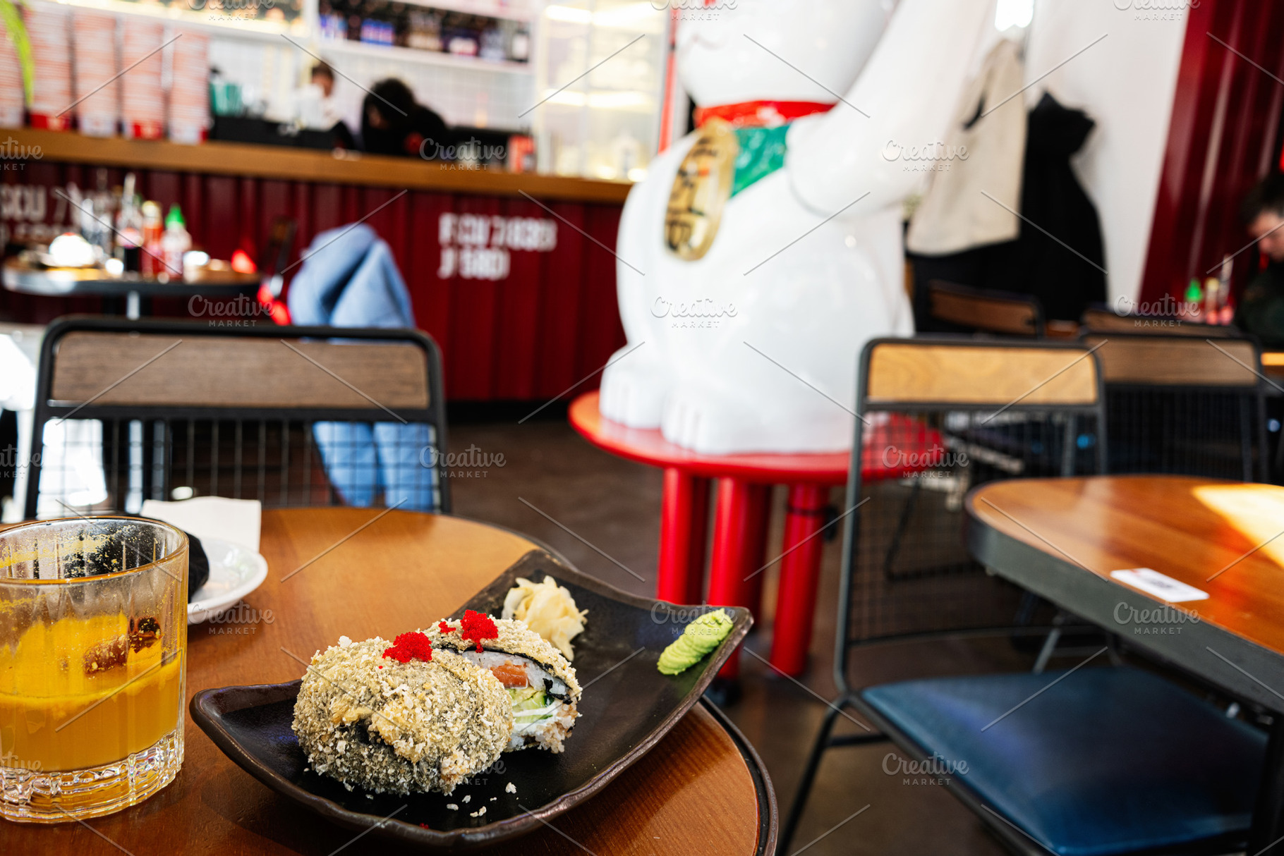 Delicious sushi meal served on a table in a Japanese restaurant interior, a Photo by AS photostudio