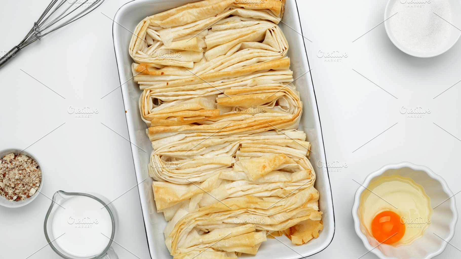 Ingredient egg, milk and sugar to make custard. Baked phyllo dough for Crinkle, a Photo by matucha