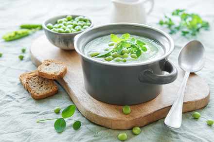 Fresh vegetable soup made of green peas, a Food & Drink Photo by Olena Rudo