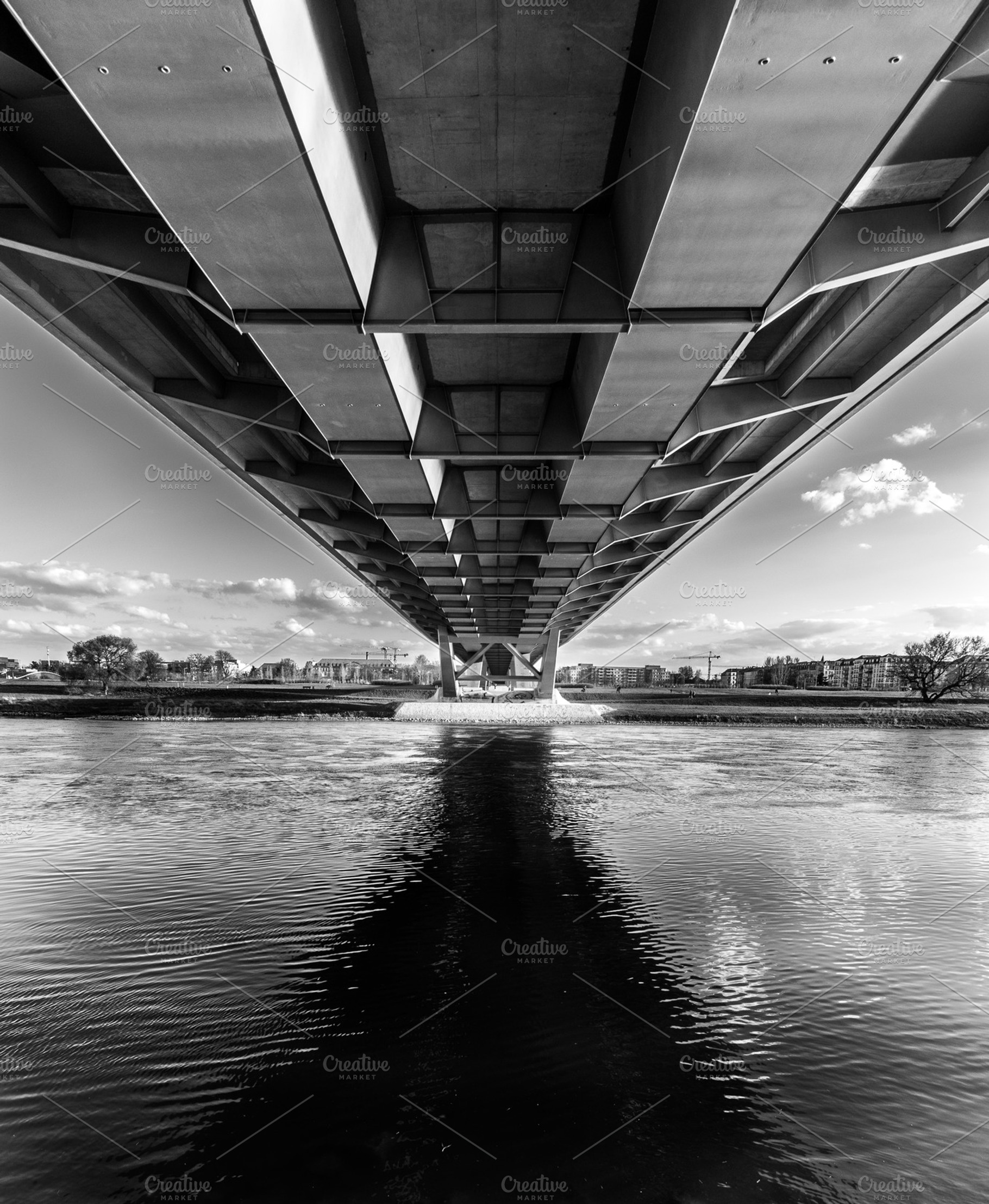 Under the bridge featuring bridge, water, and beneath, an Architecture Photo by Nex Apher