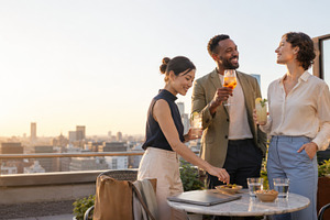 Group of adults enjoying rooftop dri, a Photo by Dvoevnore photos