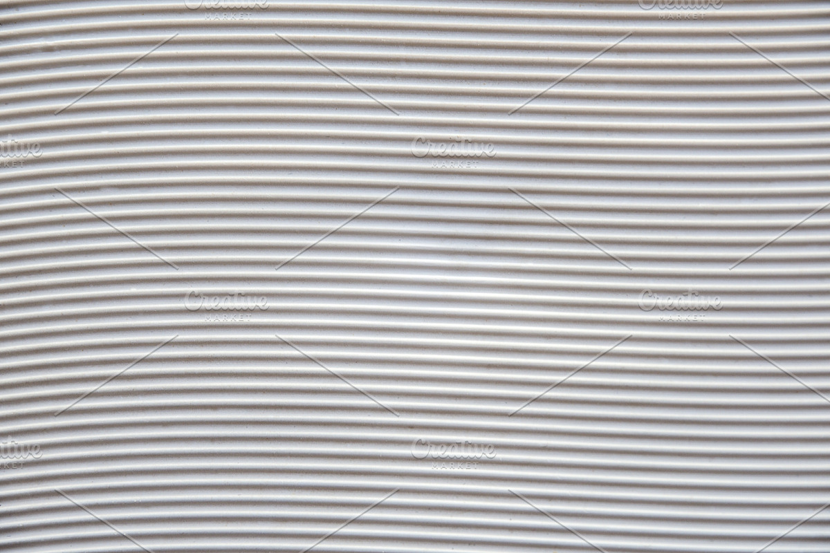 White plastic base with grooves forming horizontal waves, a Background Photo by Davizro's Market (Photo 1 of 2)