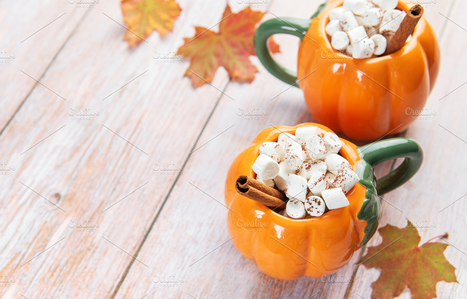 Pumpkin shaped mugs with hot chocolate and marshmallows, a Food & Drink Photo by Olena Rudo