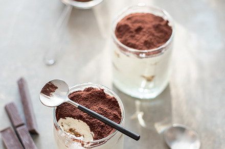 Homemade tiramisu featuring biscuits, cocoa, and coffee