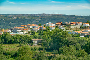 Mountain village with clustered homes among trees, an Architecture Photo by DanFLCreativo