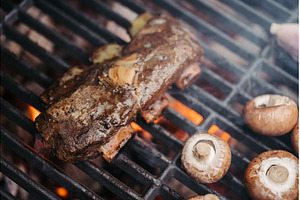 Grilling beef ribs and mushrooms on, a Food & Drink Photo by HalfPoint