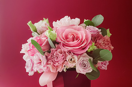 Beautiful flower box on red background, bouquet of blooming flow, a Beauty & Fashion Photo by Anneleven