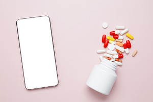 Representing medicine and healthcare. White bottle with colorful capsules and a, a Photo by matucha
