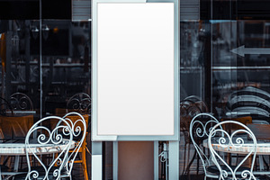 Blank Poster Mockup at Cafe Tables, a Business Photo by SkyNext
