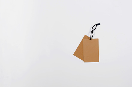Empty brown cardboard tag with  string, a Background Photo by vimart
