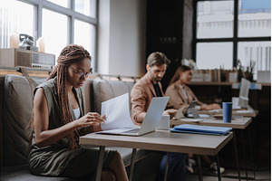 Beautiful businesswoman working on, a Business Photo by HalfPoint