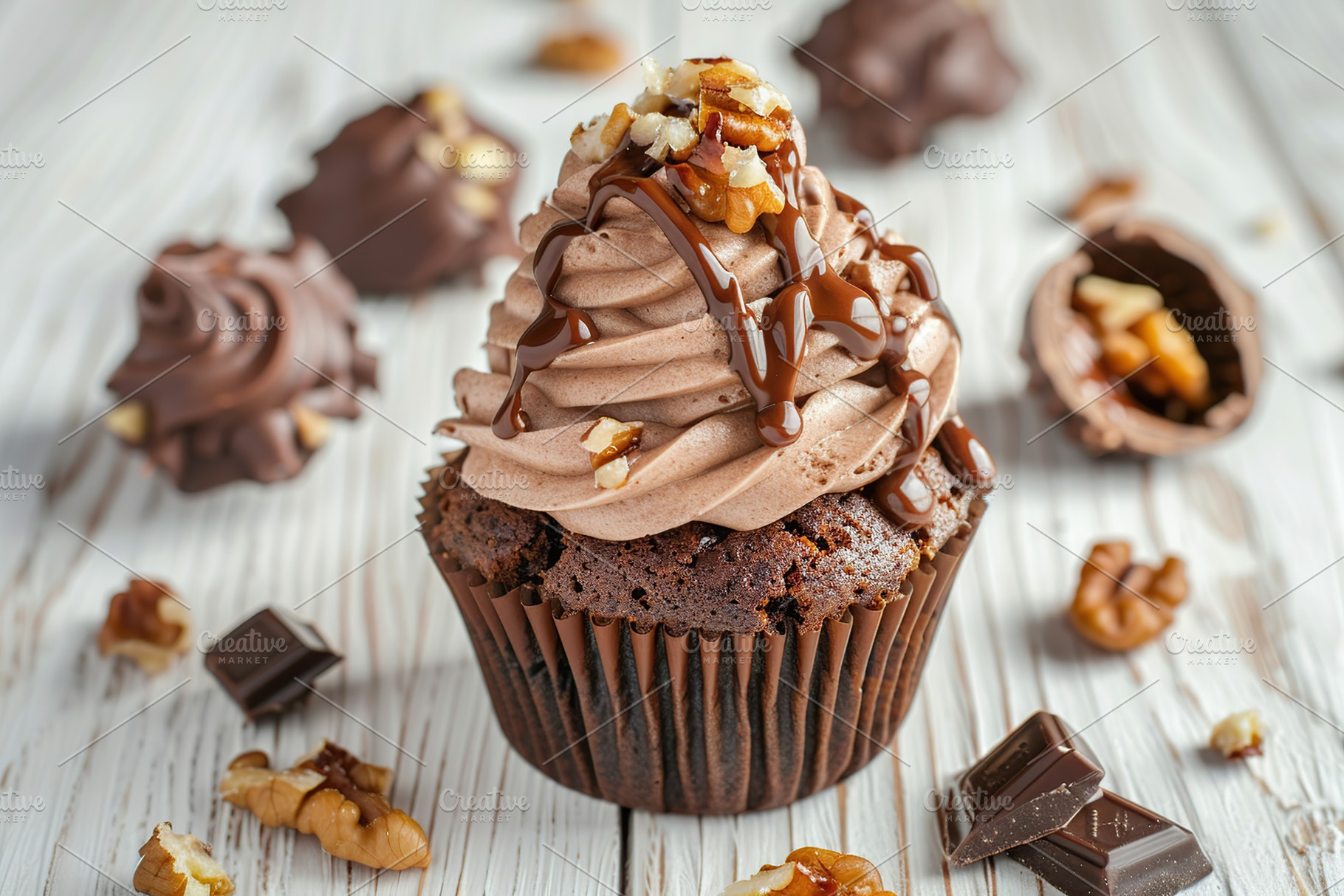 Chocolate cupcake with whipped cream and walnut on wooden table, a Food & Drink Photo by AlyaAnd