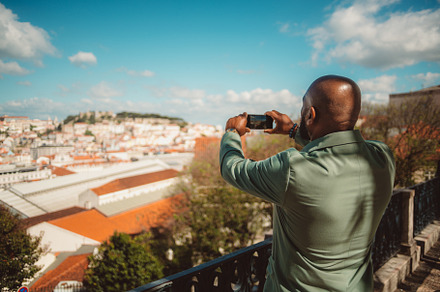 Black man capturing the city photos, a Person Photo by SkyNext