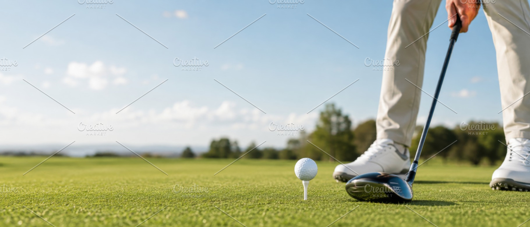 Golf player focusing on teeing off o, a Photo by Dvoevnore photos