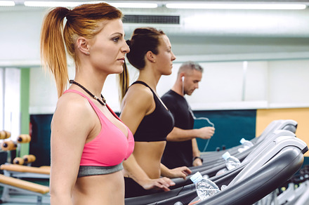 People training over treadmills on fitness center, a Sports & Recreation Photo by davidpereiras