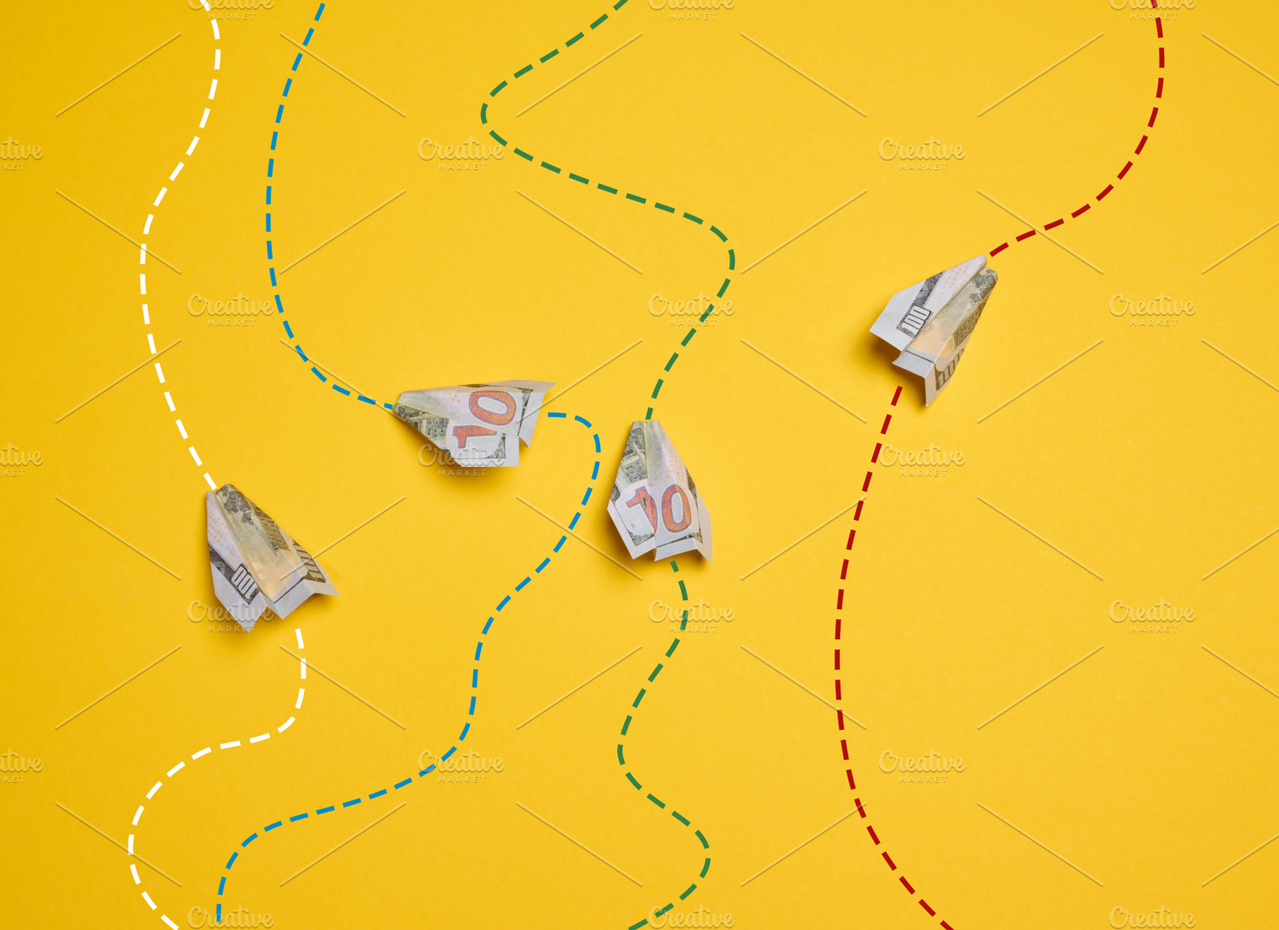 Four paper airplanes made from hundred-dollar bills, with dotted, a Business Photo by ndanko