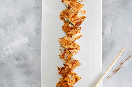 Japanese sushi close-up. Top view on a white plate, light gray vertical backgro, a Food & Drink Photo by nafood