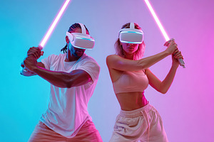 Virtual reality sword-fighting duel between two players with vivid lighting eff, a Photo by AlyaAnd