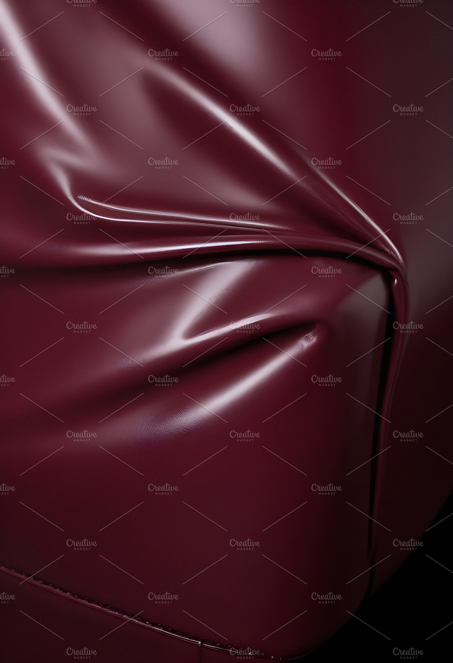 Deep maroon fabric draped elegantly on a surface, showcasing smooth texture and, a Background Photo by Kzara Visual Concepts