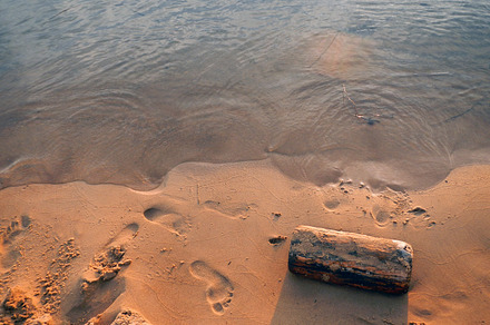 Sunset and water stock photo containing crashing water and foot